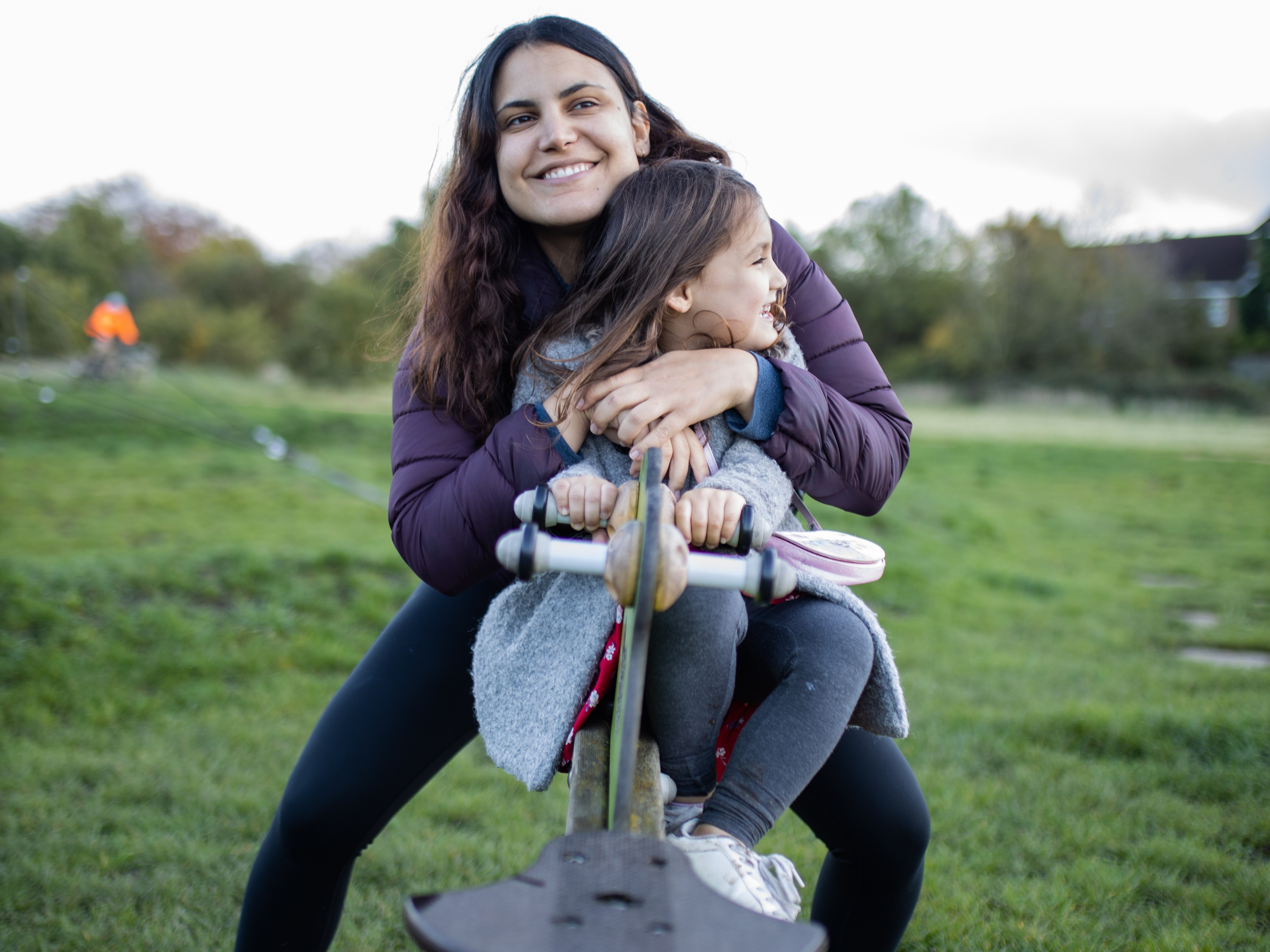 Buckingham Park, mother daughter on see saw